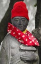 Statue with red cap and scarf